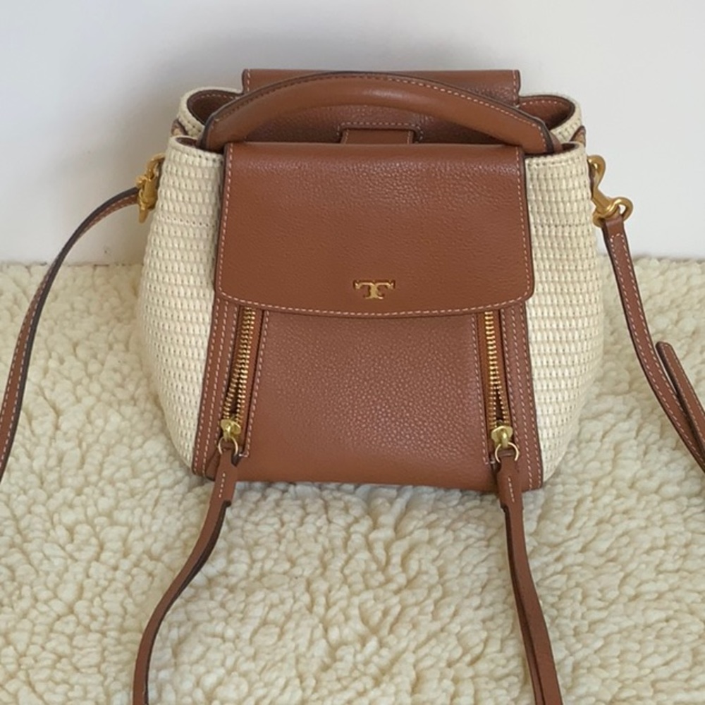 GREAT CONDITION Tory Burch Half Moon Straw Bag. One small lipstick mark inpocket